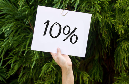 Person holding a sign that says 10%
