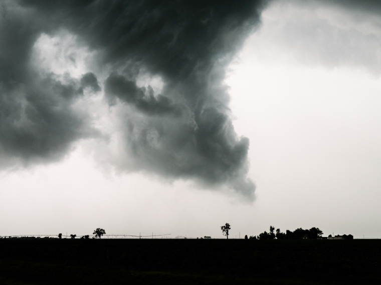 Tornado cloud forming over field