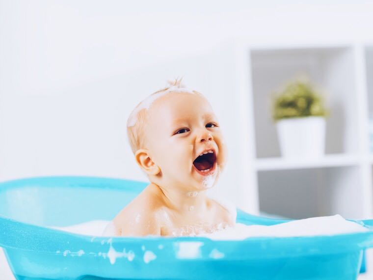 Baby laughing in bath